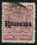 Родезия 1909-1912 гг. • Gb# 106 • 6 d. • герб колонии • надпечатка • "Rhodesia" • красно-лиловая • стандарт • Used VF ( кат.- £ 13 )